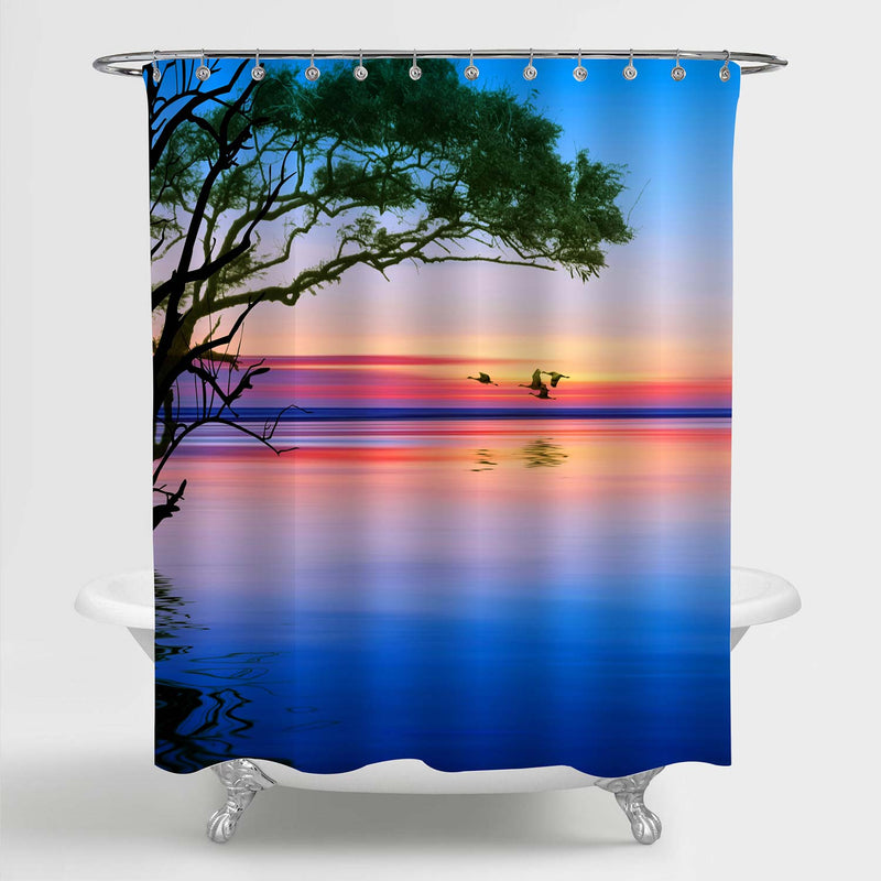 Birds Silhouettes Flying Above the Lake Against Sunset Shower Curtain - Blue Gold